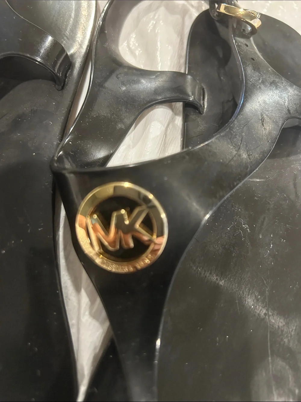 Michael Kors Black Jelly Logo Thong Sandals with Gold MK Medallion
